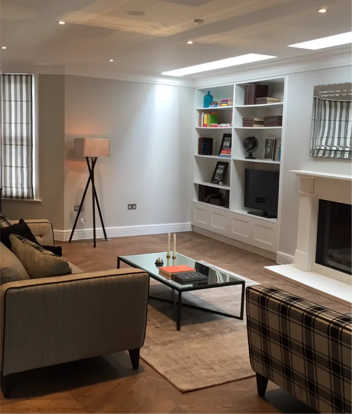 Elegant living space with built-in shelving, cozy lighting, and a warm ambiance for relaxation